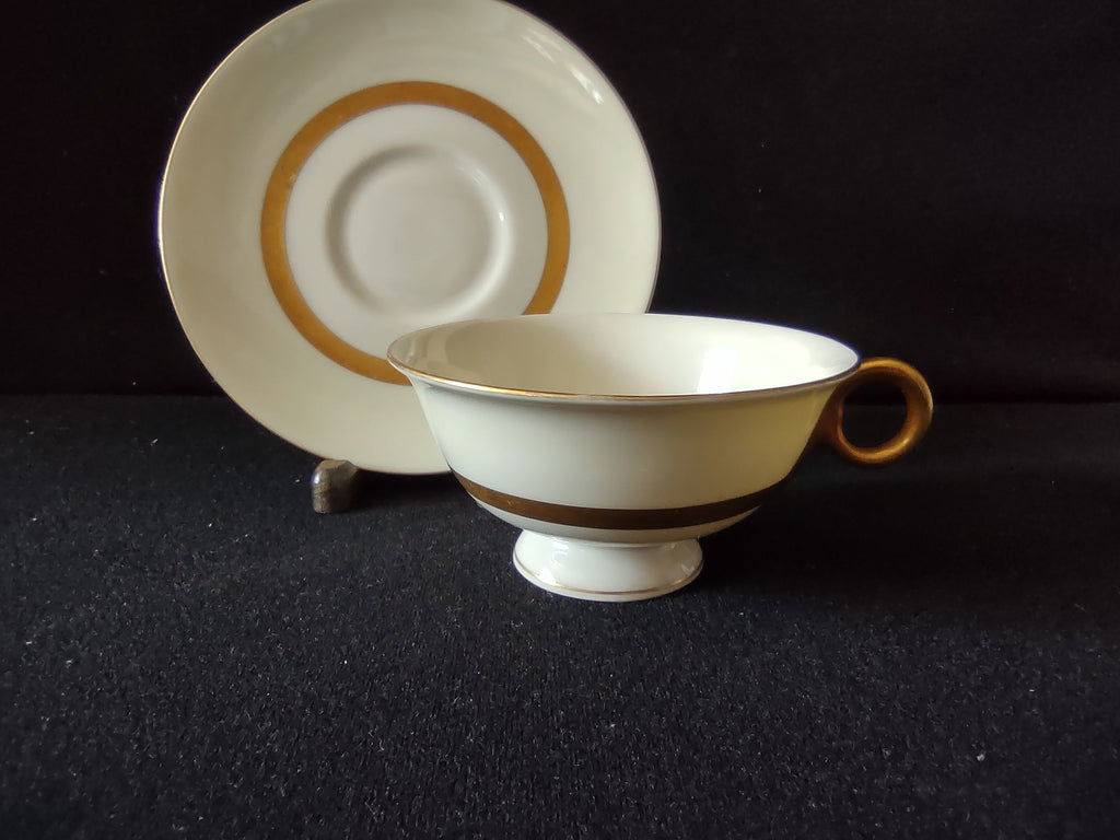 Gotham cup gold ring handle close-up
