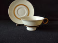 Gotham cup gold ring handle close-up