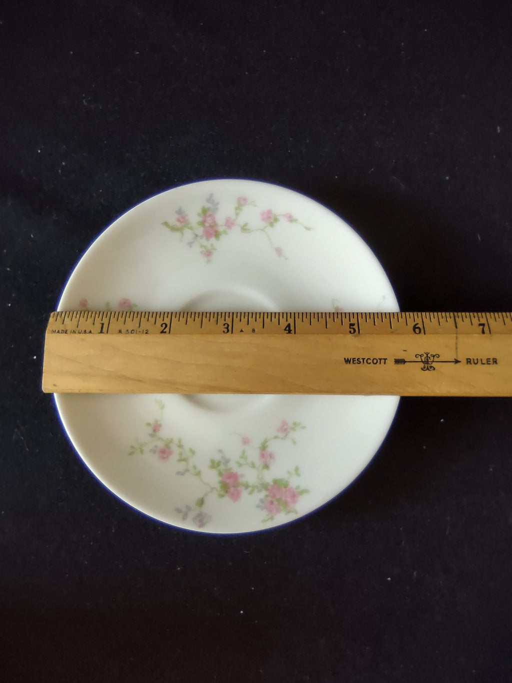 Theodore Haviland Pink Spray teacup with gold handle close-up