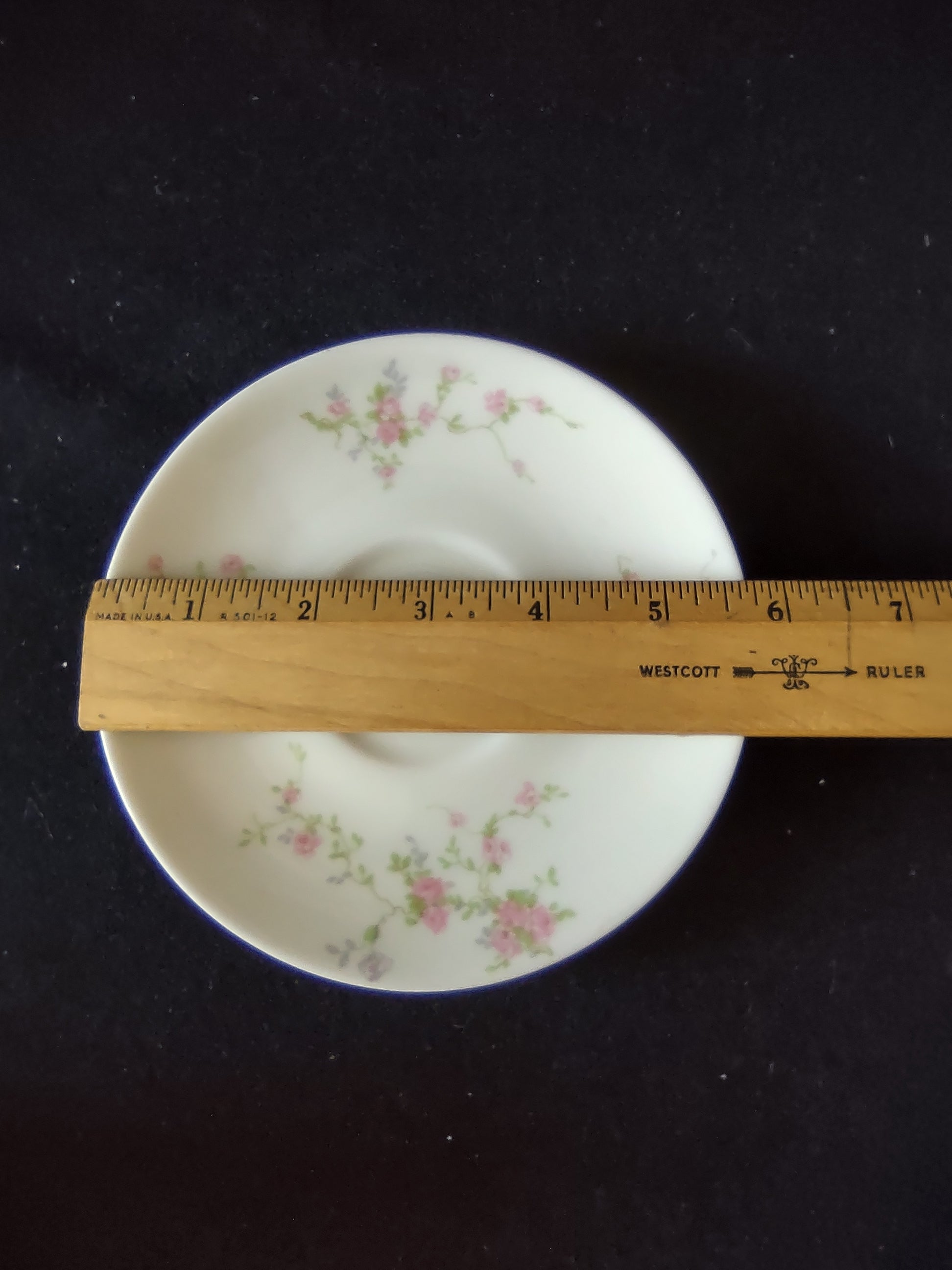 Theodore Haviland Pink Spray teacup with gold handle close-up