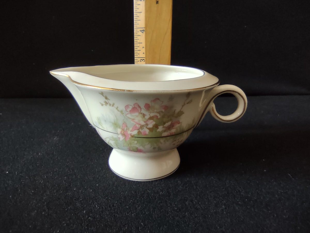 Vintage Theodore Haviland New York Apple Blossom footed creamer side view with ruler showing approximately 3 inch height