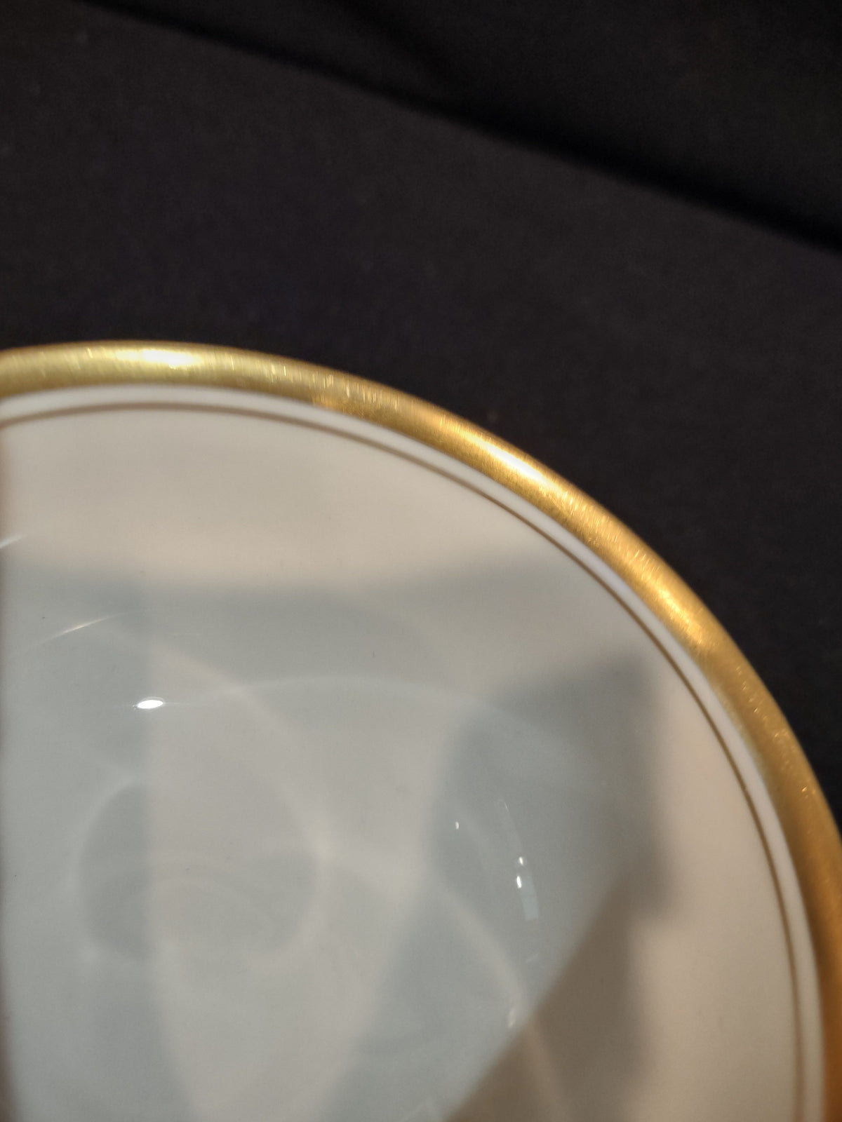 Gold rim wear detail close-up