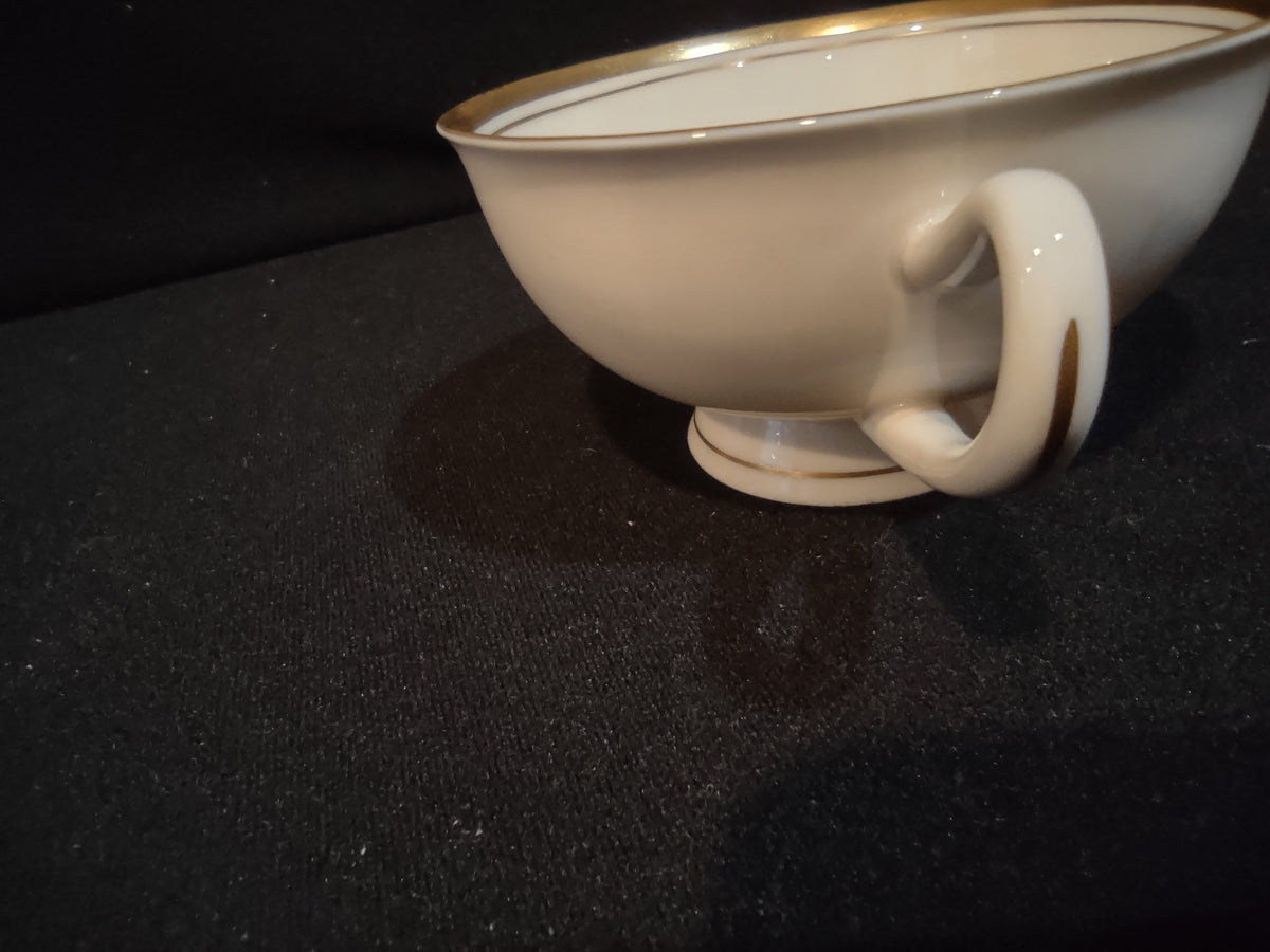 Interior of Syracuse China tea cup with gold rim