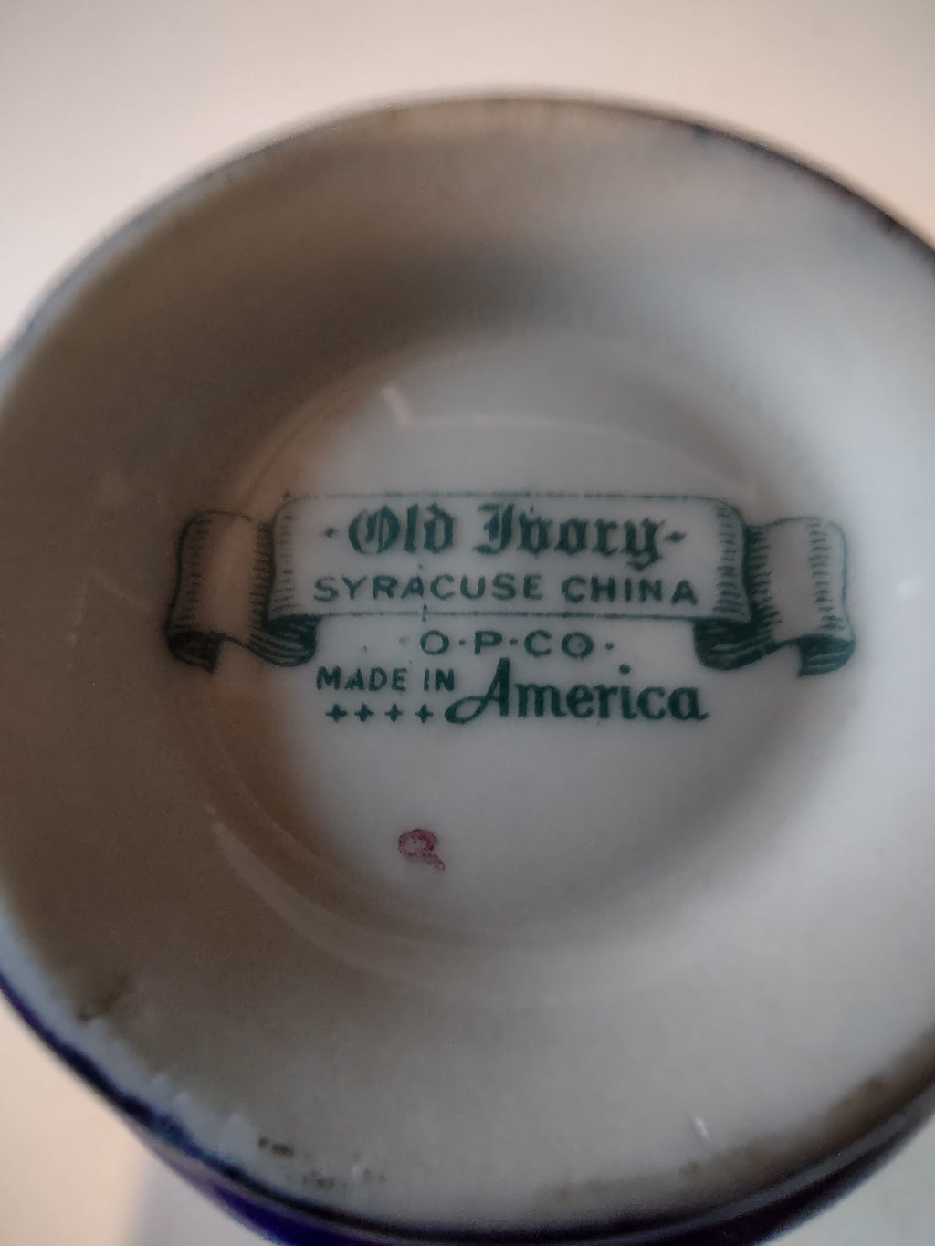 Syracuse China cobalt blue saucer side view with ruler
