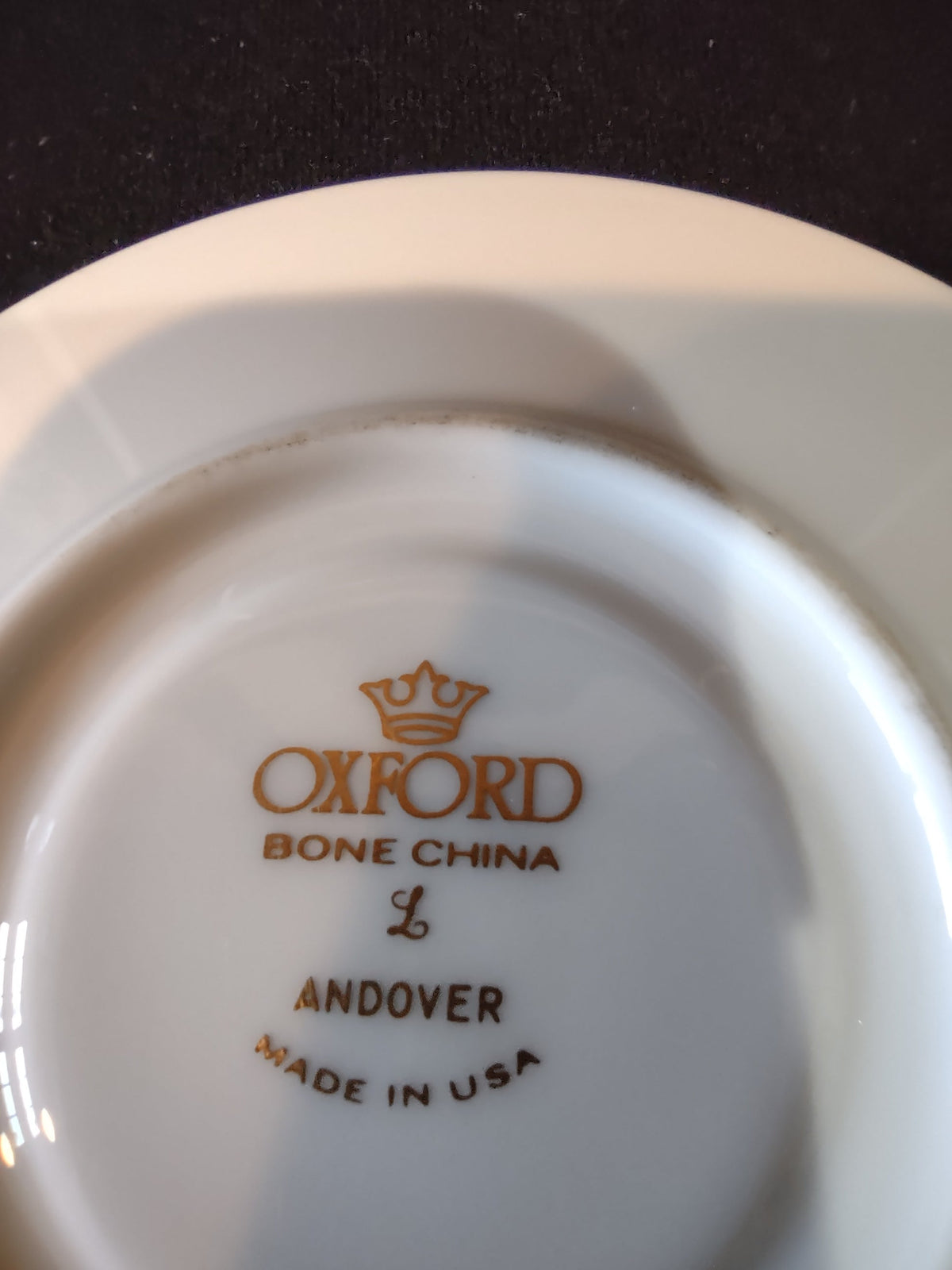 Oxford Bone China Andover saucer - close-up of gold band showing spot on rim