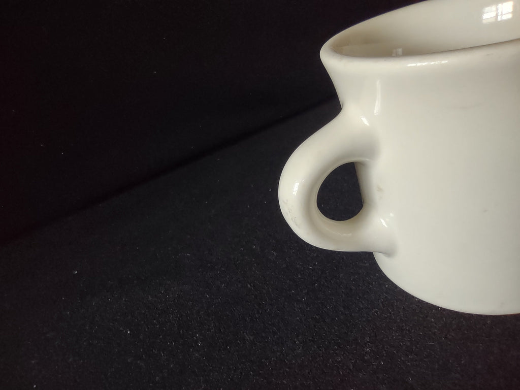 Vintage off-white diner coffee mug side view opposite handle