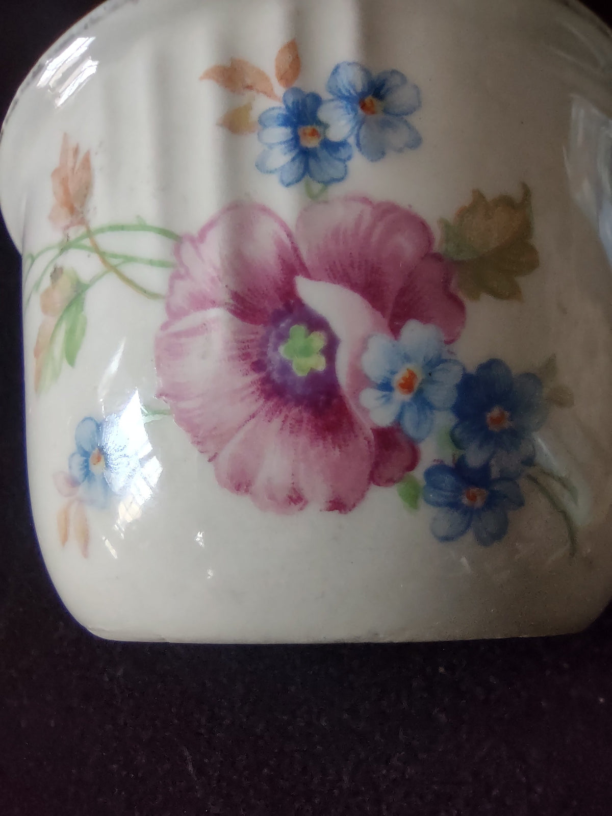 Vintage Floral Ribbed Cup - angled view showing full floral pattern and rim discoloration