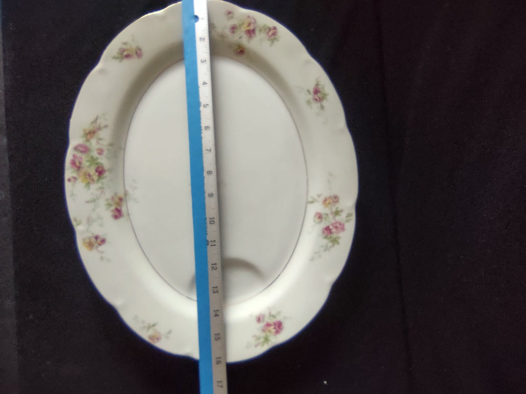 Theodore Haviland Dorset platter side view showing scalloped rim and floral sprays