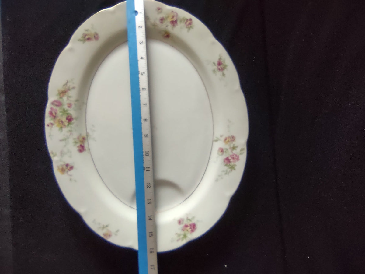 Theodore Haviland Dorset platter side view showing scalloped rim and floral sprays