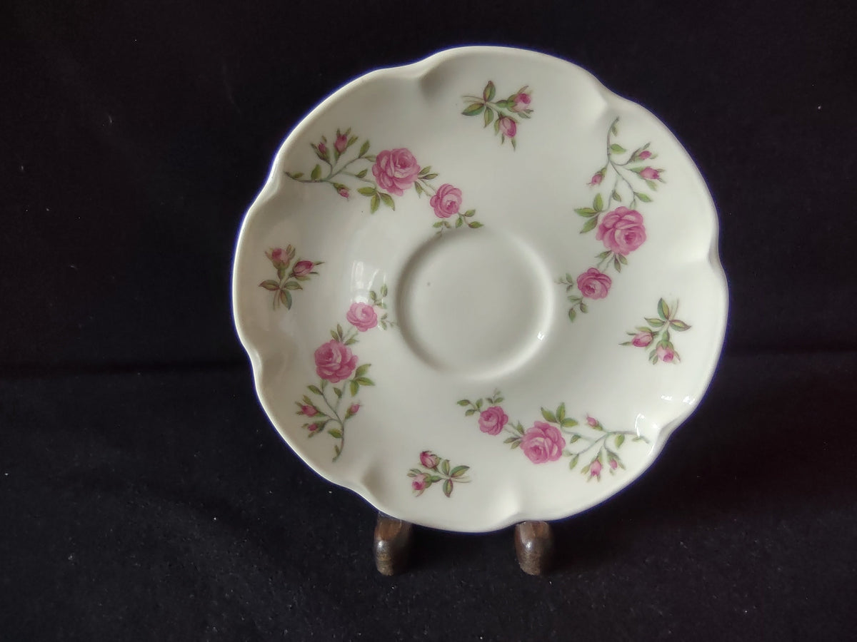 Theodore Haviland Delaware saucer front showing pink roses and scalloped edge