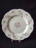 Vintage pink rose scalloped plate front view on display stand