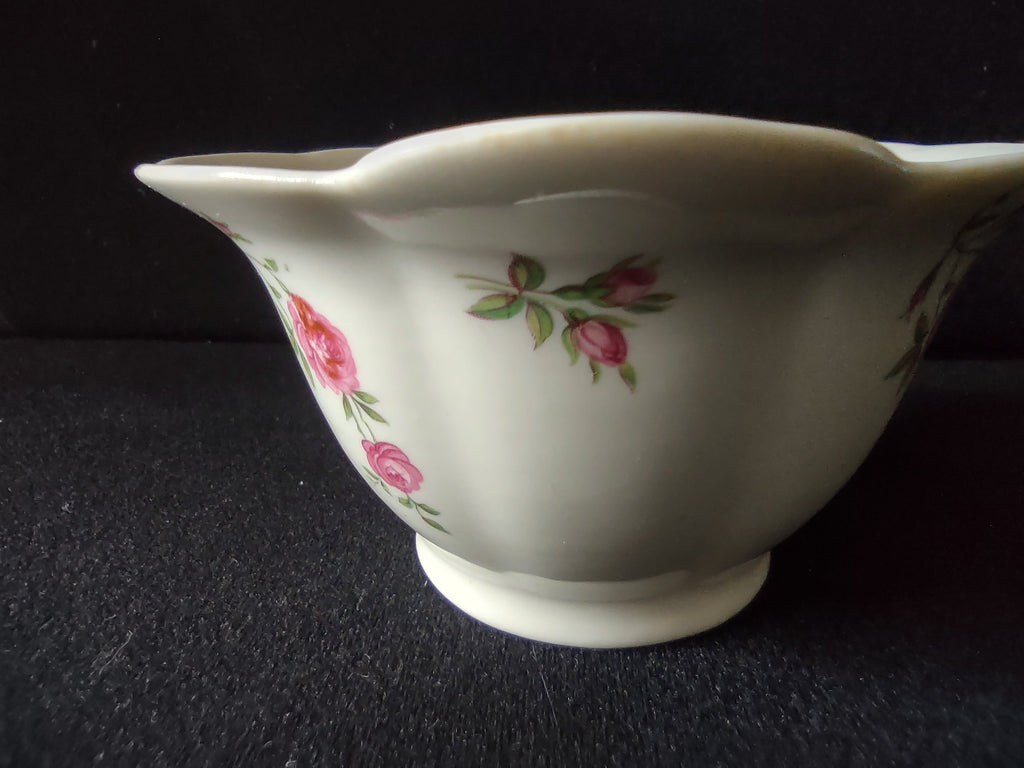 Sugar bowl side view showing footed base and flared silhouette