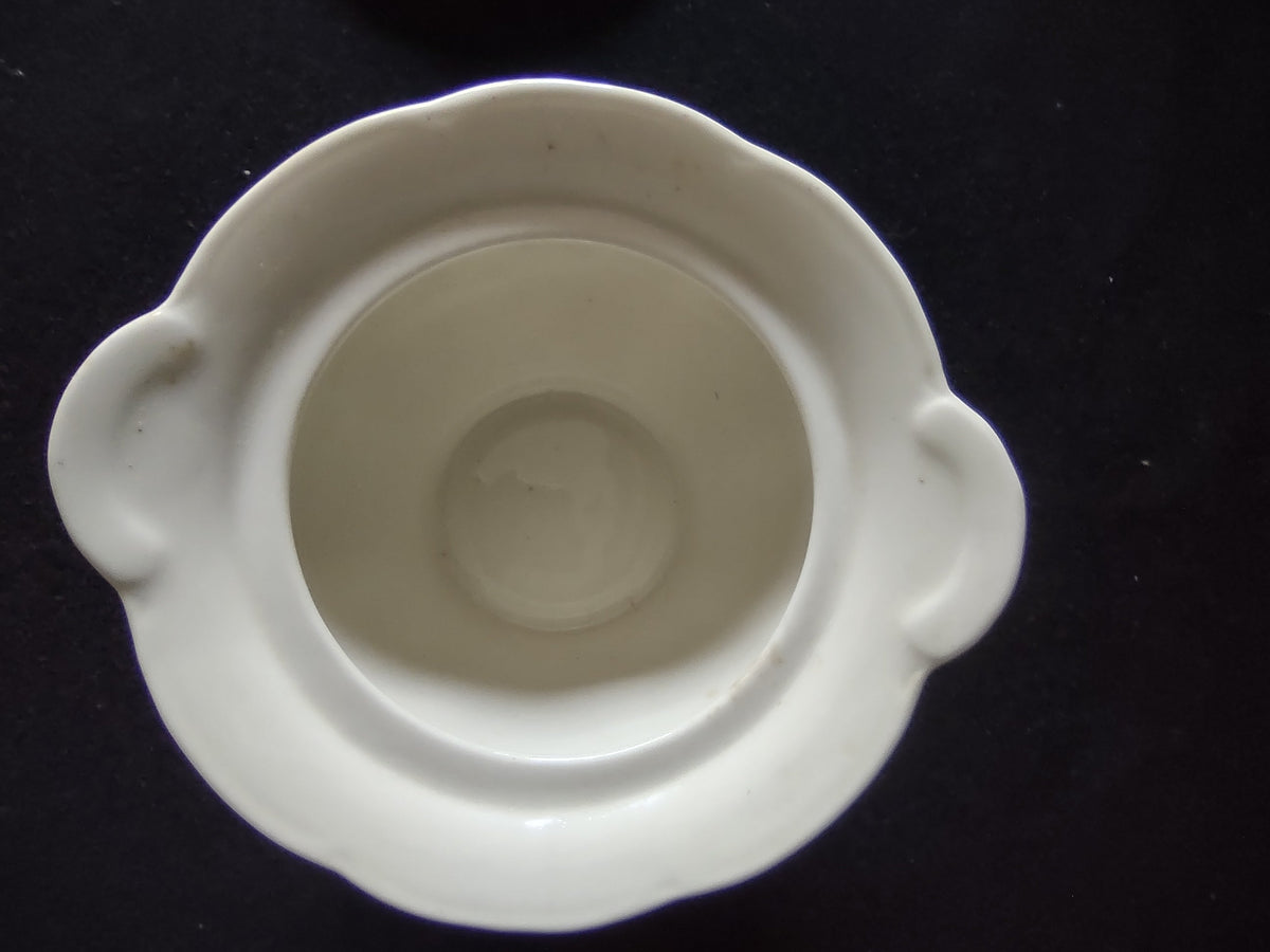 Sugar bowl detail showing pink rose and green leaf pattern
