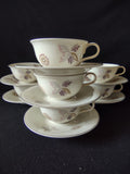 Vintage Lenox cup and saucer set of 5 stacked, showing floral pink and gray pattern with platinum rim
