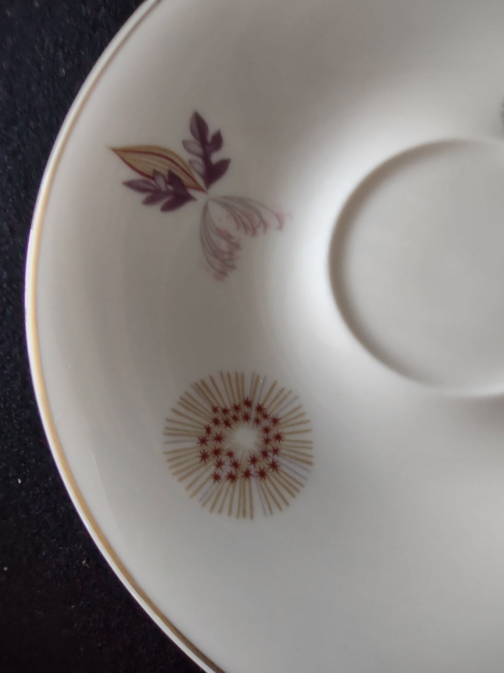 Top-down view of Lenox saucer interior with floral motif