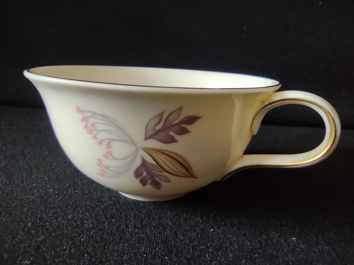 Lenox vintage cup and saucer pair showing floral pattern — pink bloom, olive and gray leaves, gray daisy accents