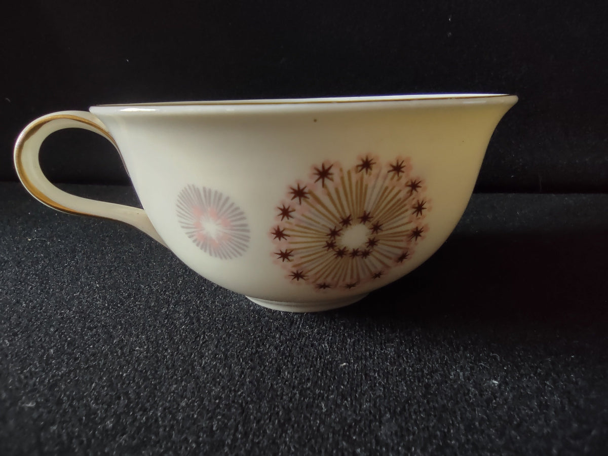 Side view of Lenox vintage cup showing pink bloom and gray-purple leaf pattern with gold handle accent