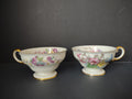 Set of 2 Castleton China Phoenix footed teacups with gold handles and colorful floral decoration
