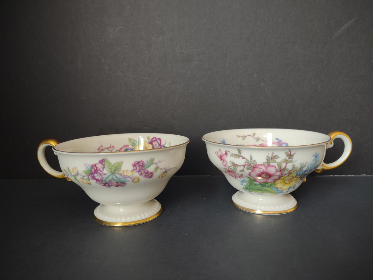 Set of 2 Castleton China Phoenix footed teacups with gold handles and colorful floral decoration