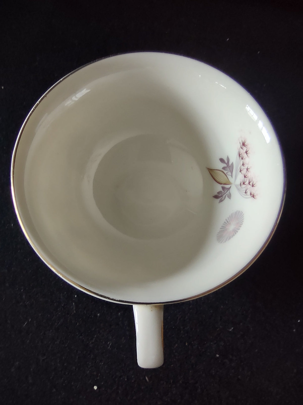 Top-down view of Lenox vintage saucer interior showing floral pattern with gray daisy and leaf sprigs