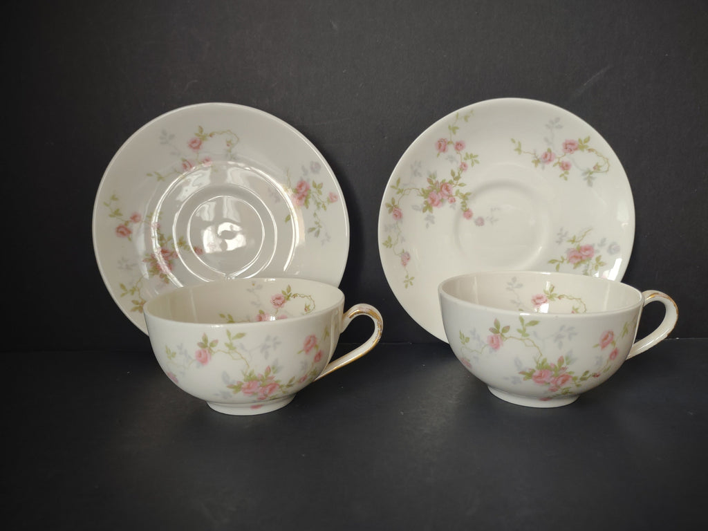 Set of 2 Theodore Haviland Touraine teacup and saucer sets with scattered pink rose sprigs