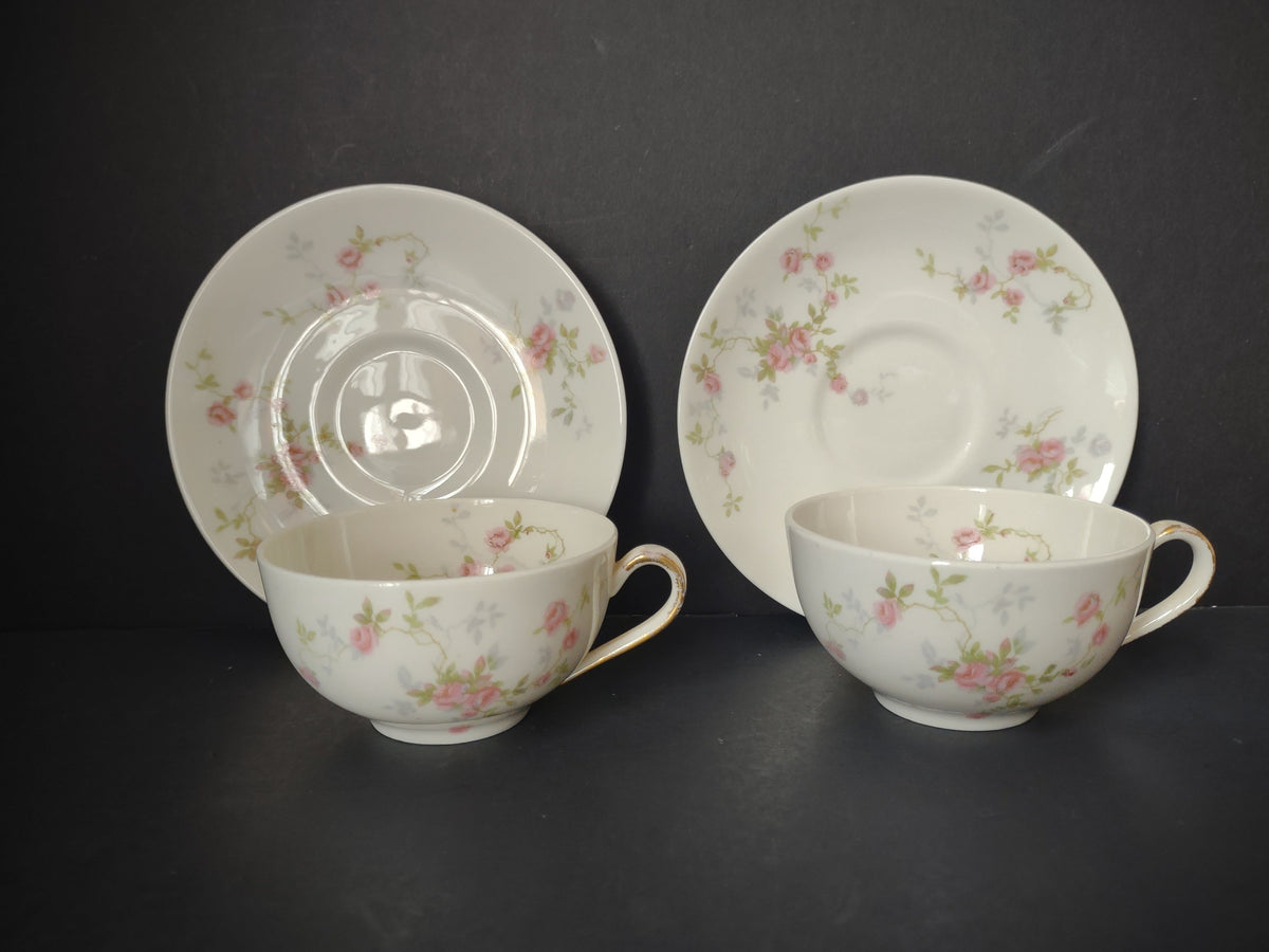 Set of 2 Theodore Haviland Touraine teacup and saucer sets with scattered pink rose sprigs