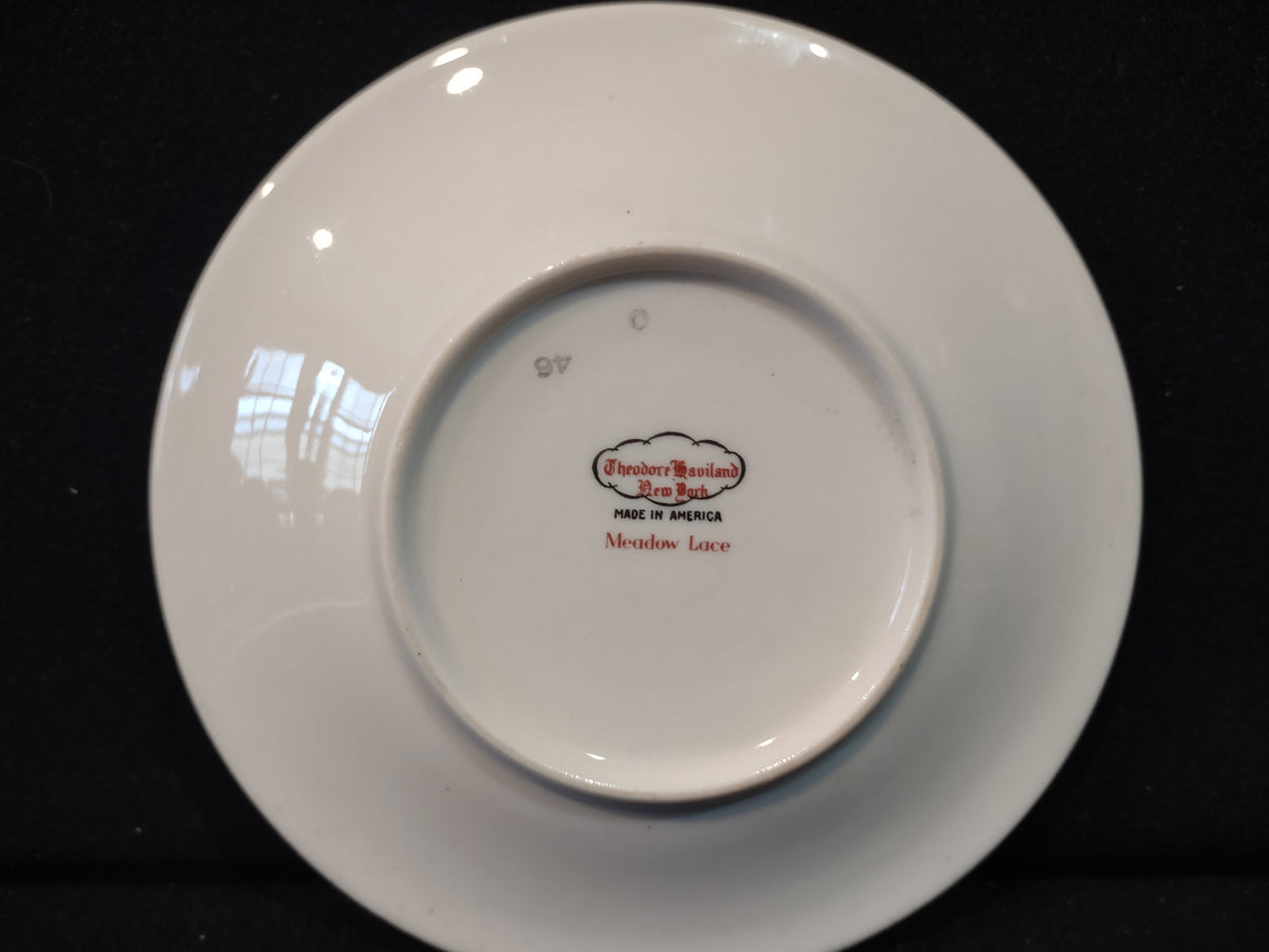 Vintage Theodore Haviland NY Meadow Lace saucer with purple floral motif, approximately 6 inches diameter