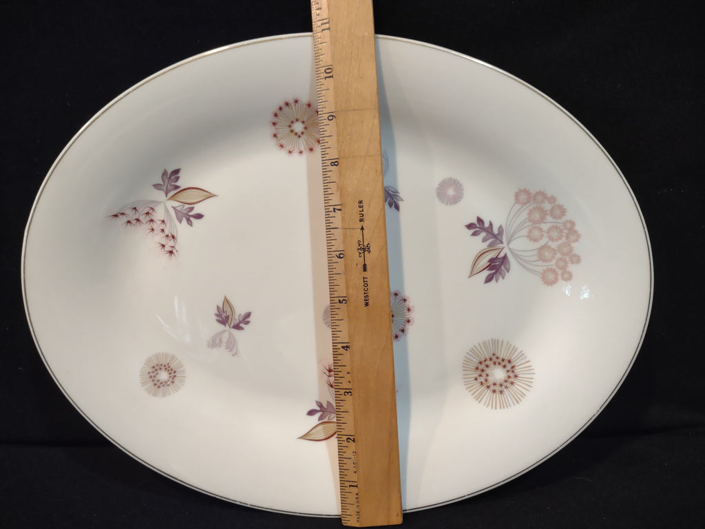 Vintage Theodore Haviland NY Meadow Lace oval serving platter with ruler showing approximately 9 inches along short axis