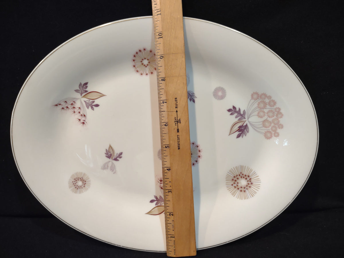Vintage Theodore Haviland NY Meadow Lace oval serving platter with ruler showing approximately 9 inches along short axis