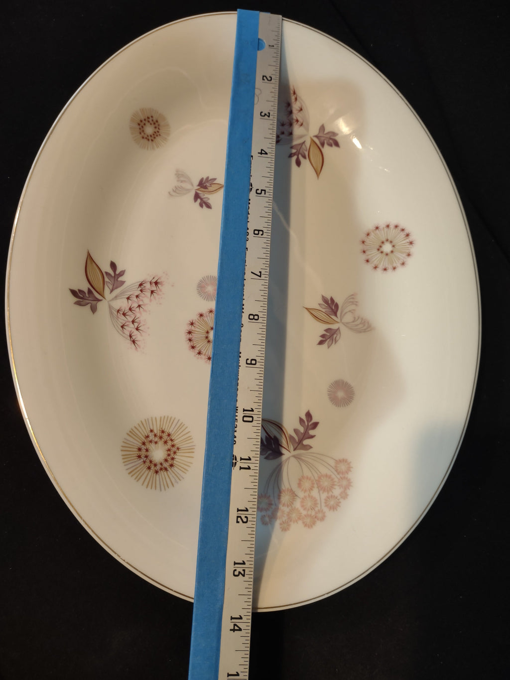 Vintage Theodore Haviland NY Meadow Lace oval platter with tape measure showing approximately 11 inches along long axis