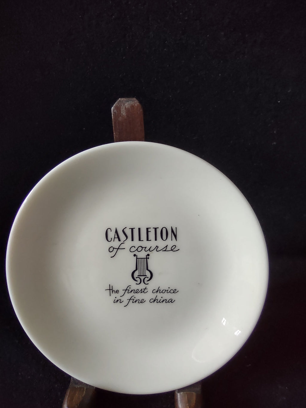 Vintage Castleton China white butter pat saucer top view showing plain white glaze