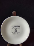 Vintage Castleton China white butter pat saucer top view showing plain white glaze