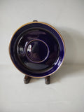 Vintage cobalt blue saucer with gold trim bands side profile view