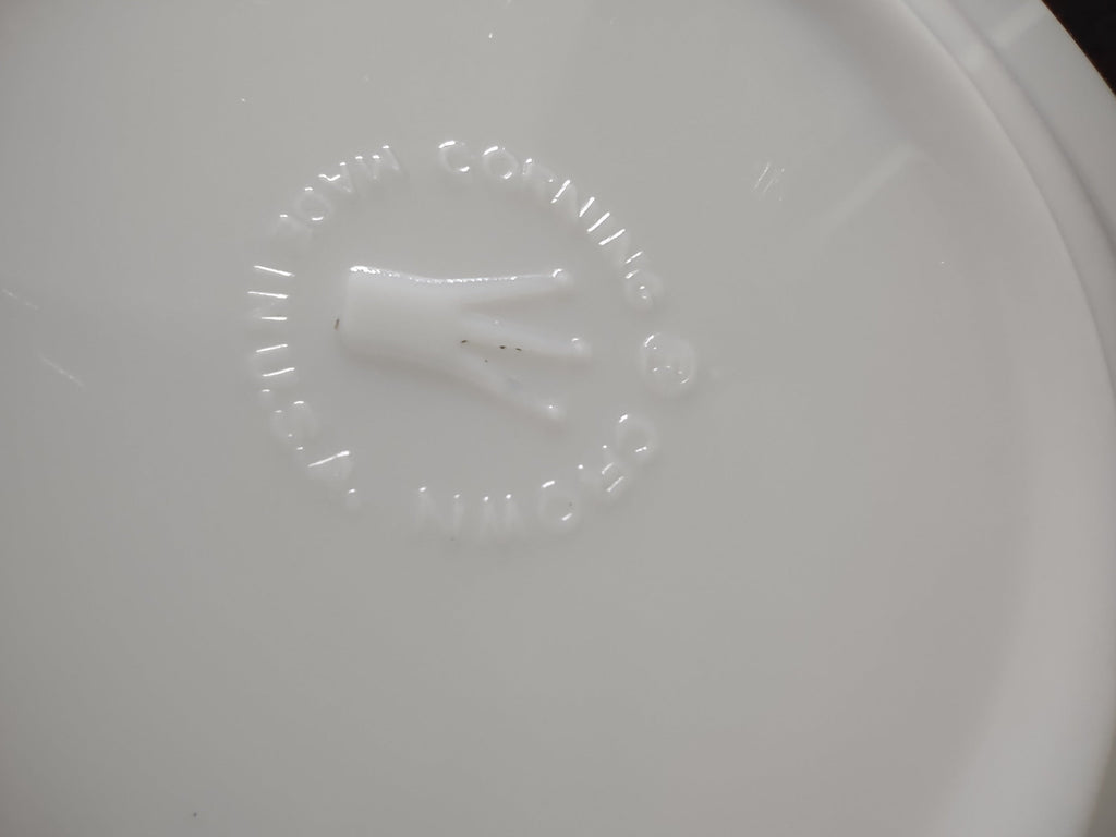 Vintage white porcelain plate with ruler showing approximately 7 inch diameter