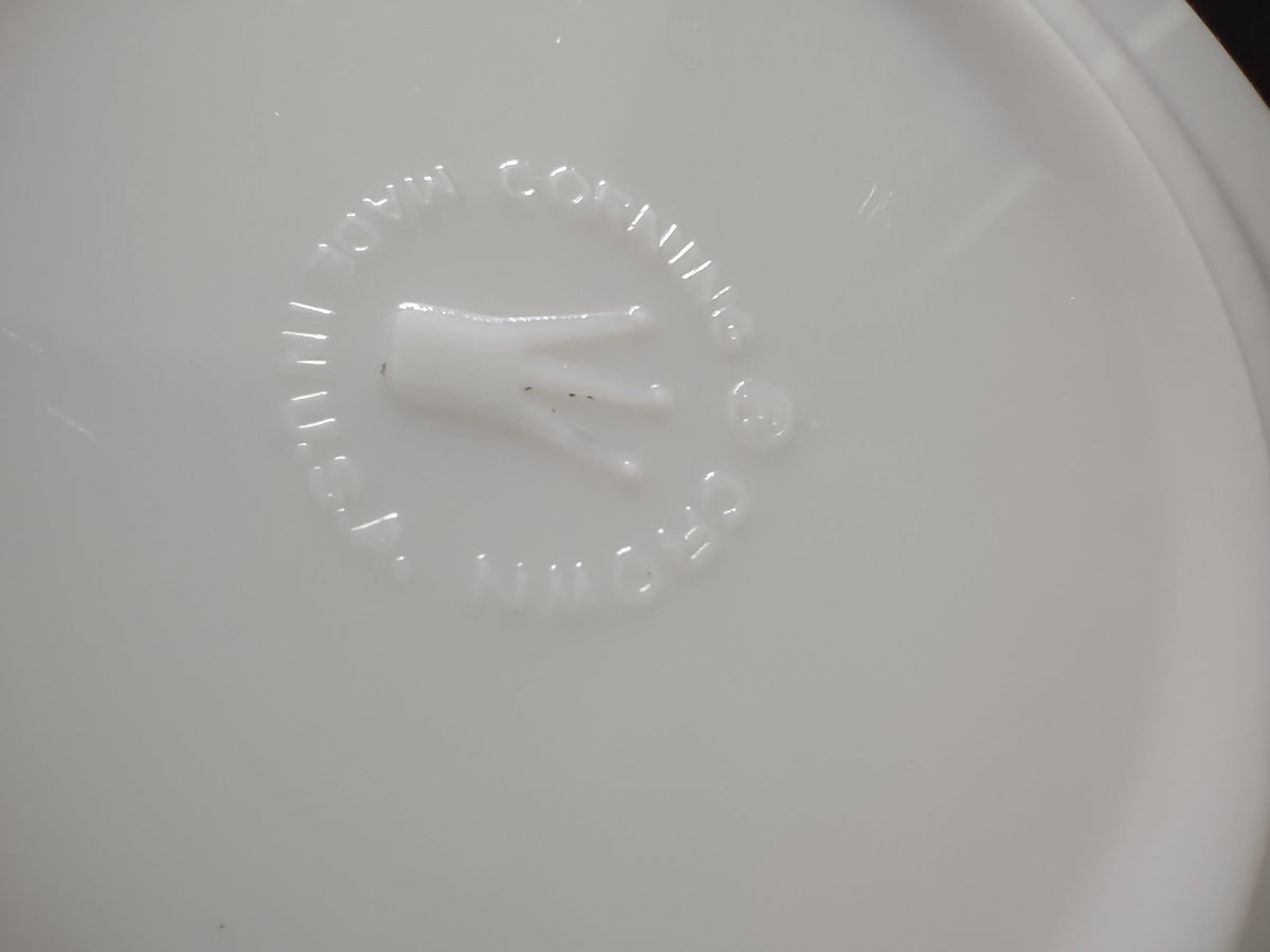 Vintage white porcelain plate with ruler showing approximately 7 inch diameter