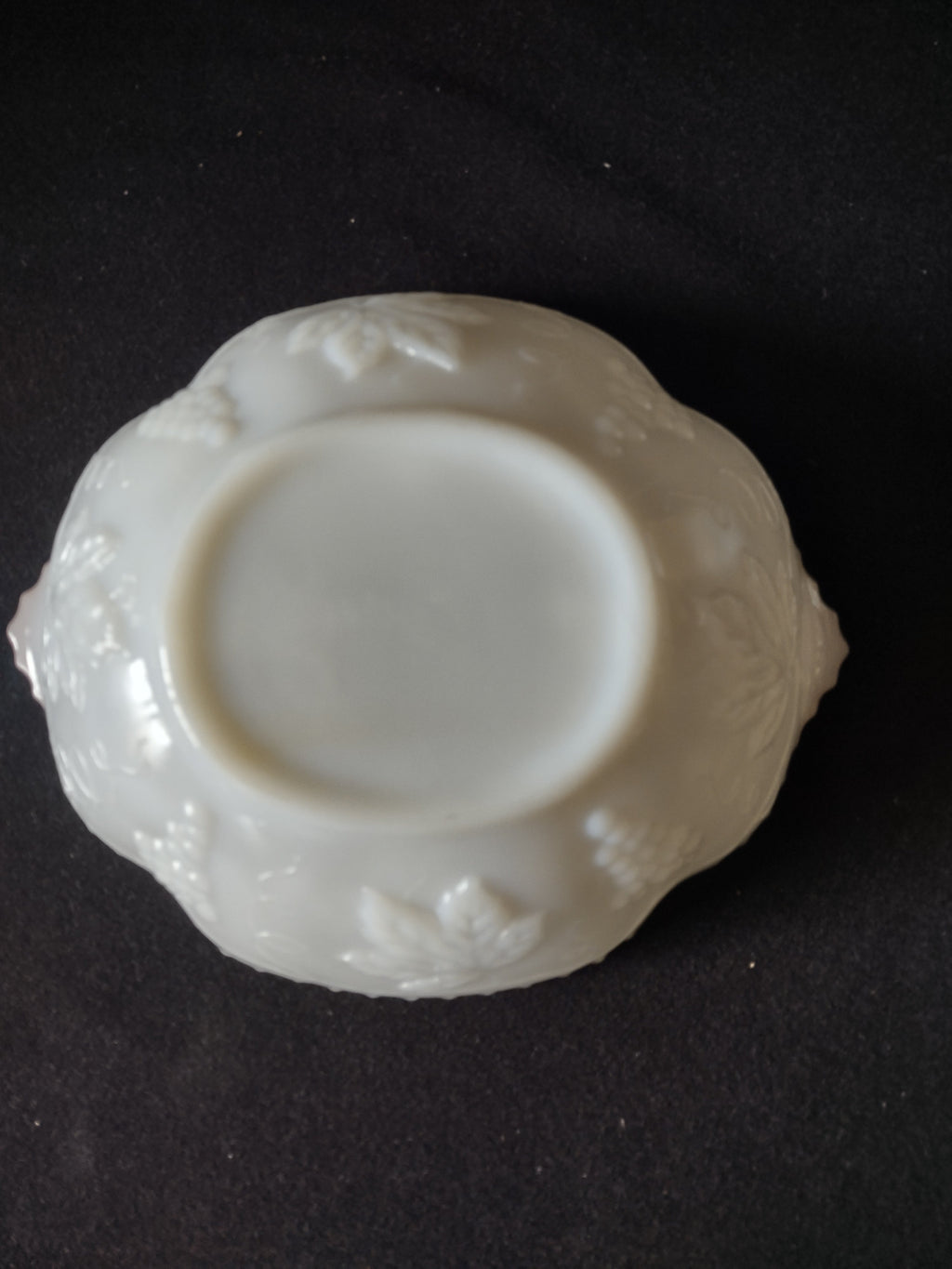 Full back view of vintage white embossed scalloped plate
