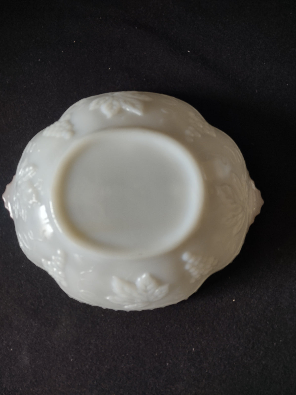 Full back view of vintage white embossed scalloped plate