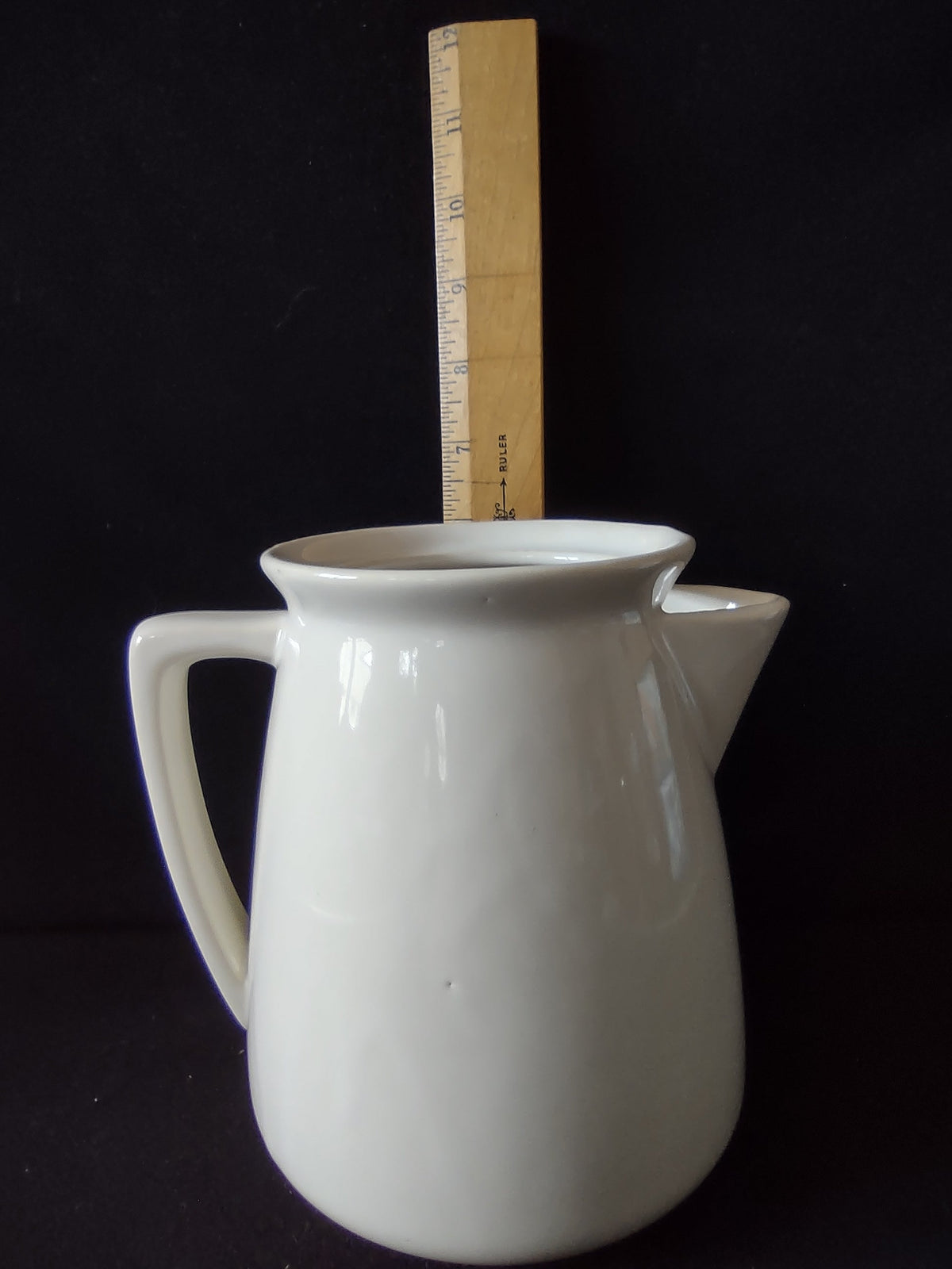 Top-down view of vintage ACv USA ceramic pitcher opening