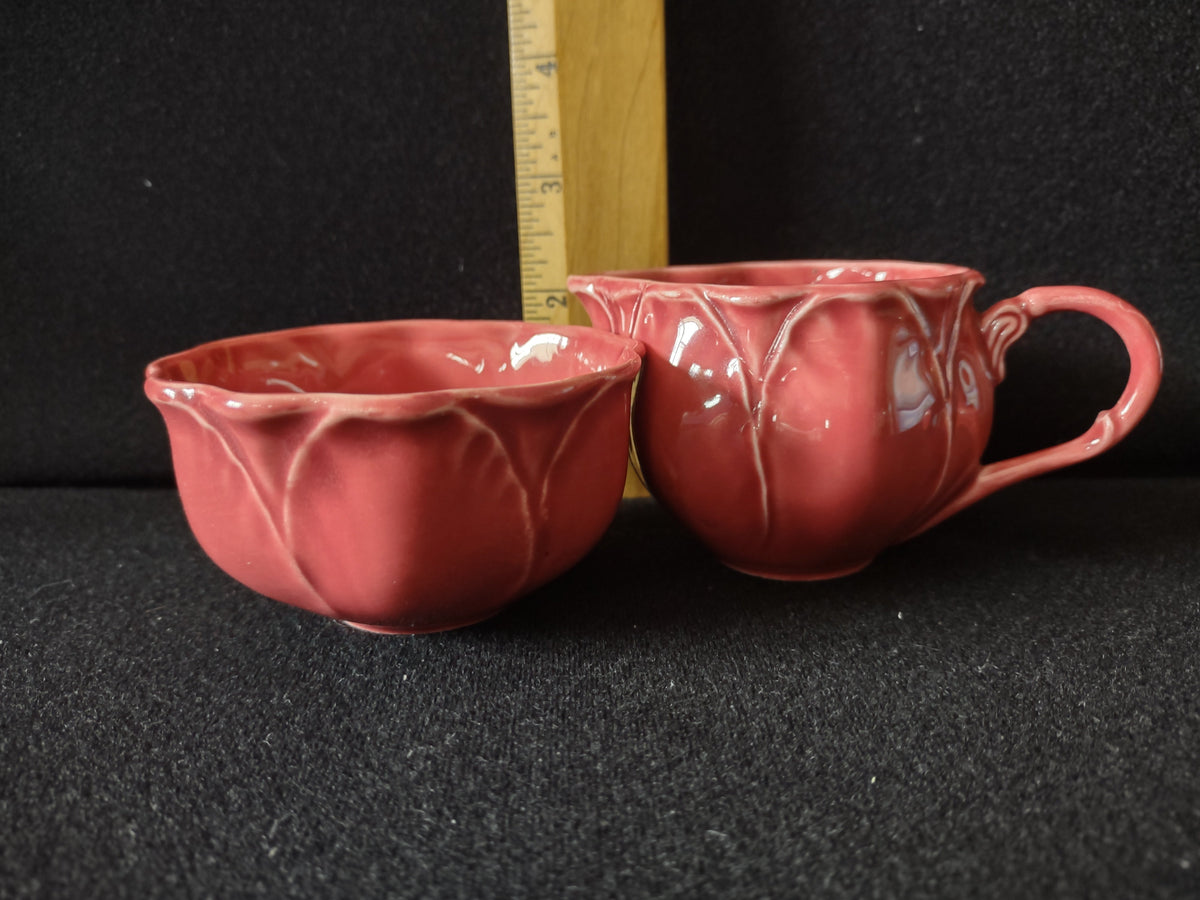 Vintage pink tulip creamer interior top-down view showing glaze pooling consistent with age