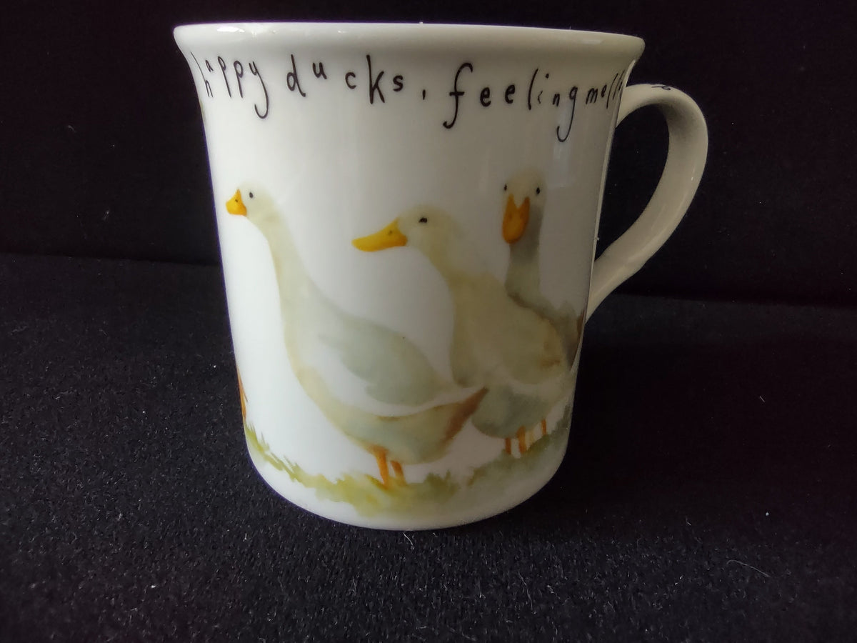 Side view: yellow duckling and white duck, feathers white beaks yellow text