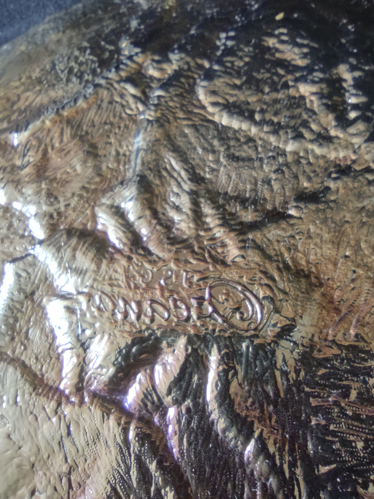 Additional detail view of bronze gold art glass surface texture