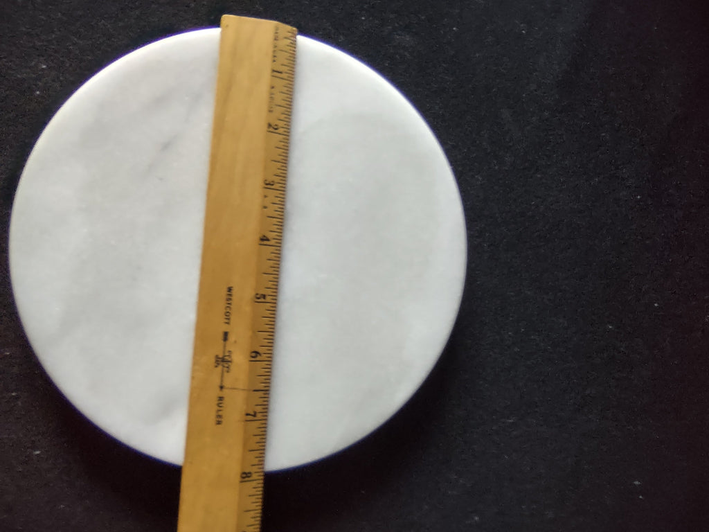 White marble round trivet serving board - top view with ruler showing 12" diameter