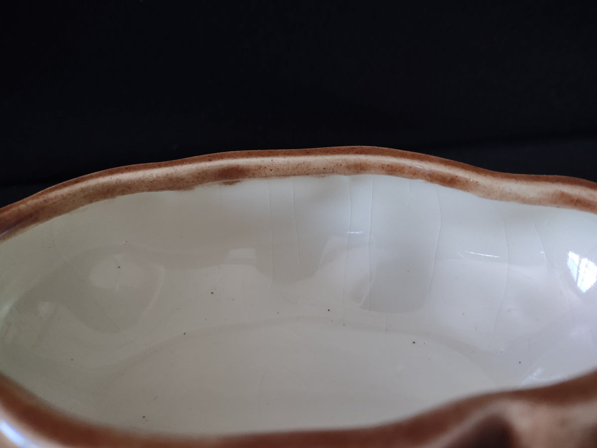 Atlantic Mold potato covered bowl with lid and white ceramic spoon, ruler showing height