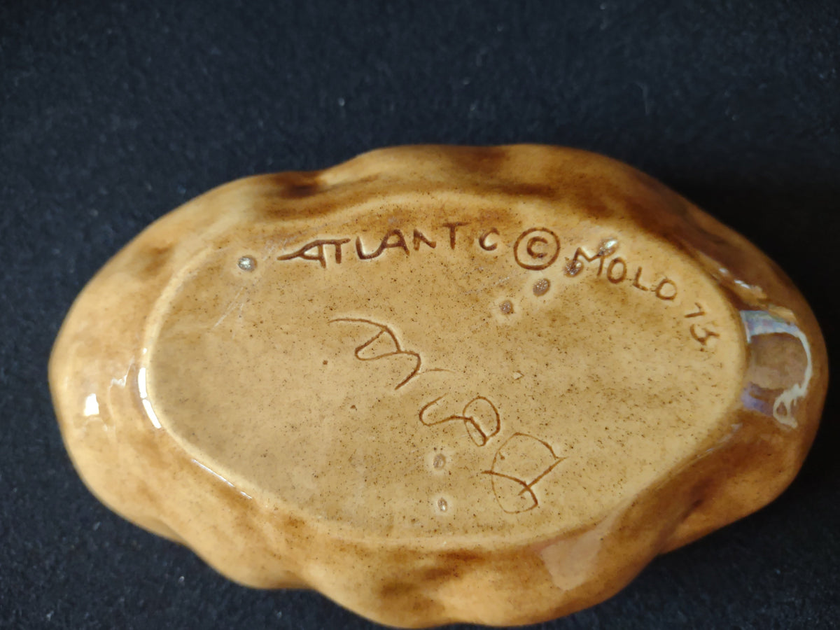 Atlantic Mold backstamp reading ATLANTIC MOLD 75 with artist signature on bottom