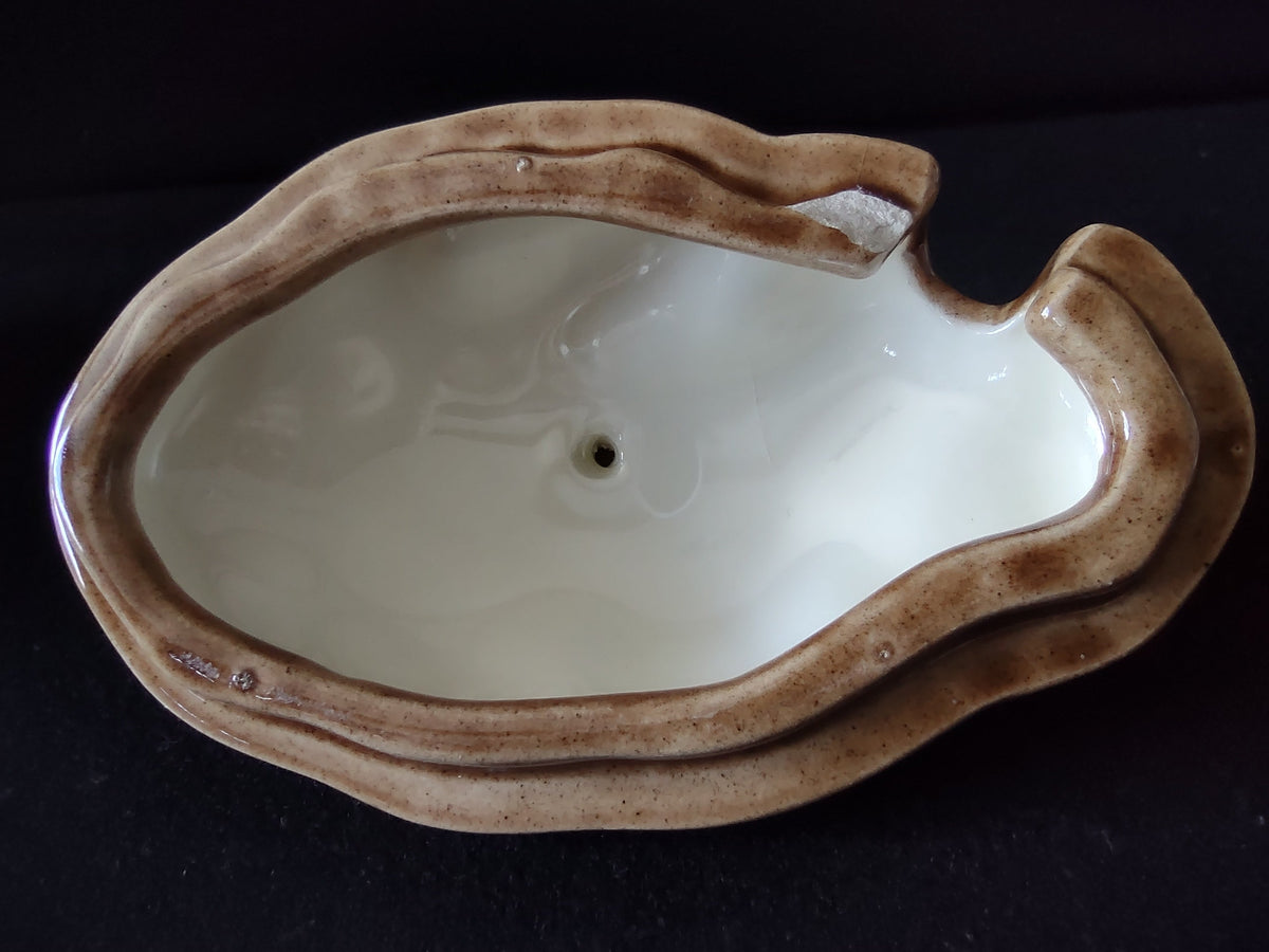Atlantic Mold potato bowl lid top view showing sculpted knob and brown tan glaze