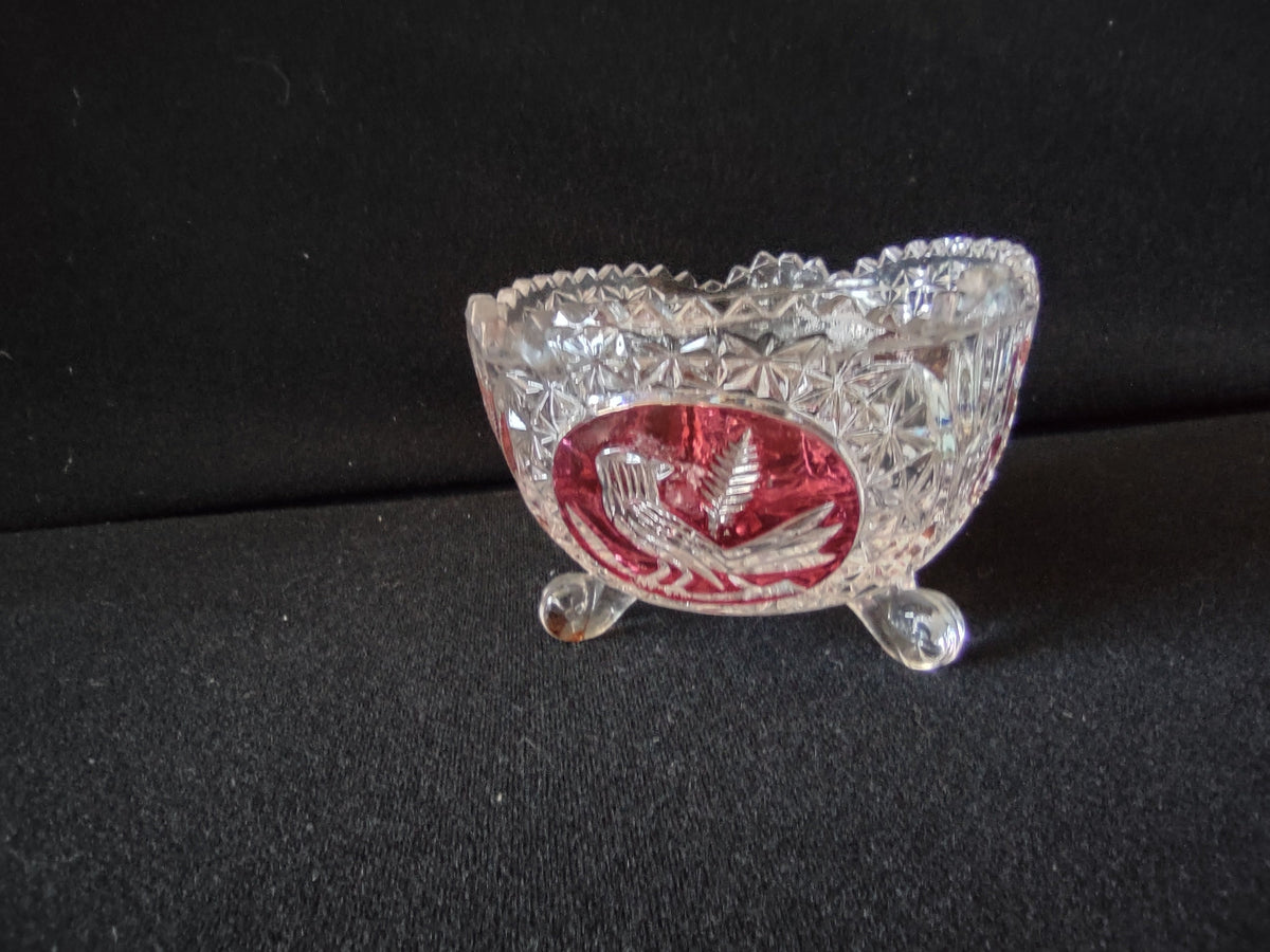 Hofbauer Bleikristall ruby red flash crystal footed bowl, front view showing bird and fern medallion