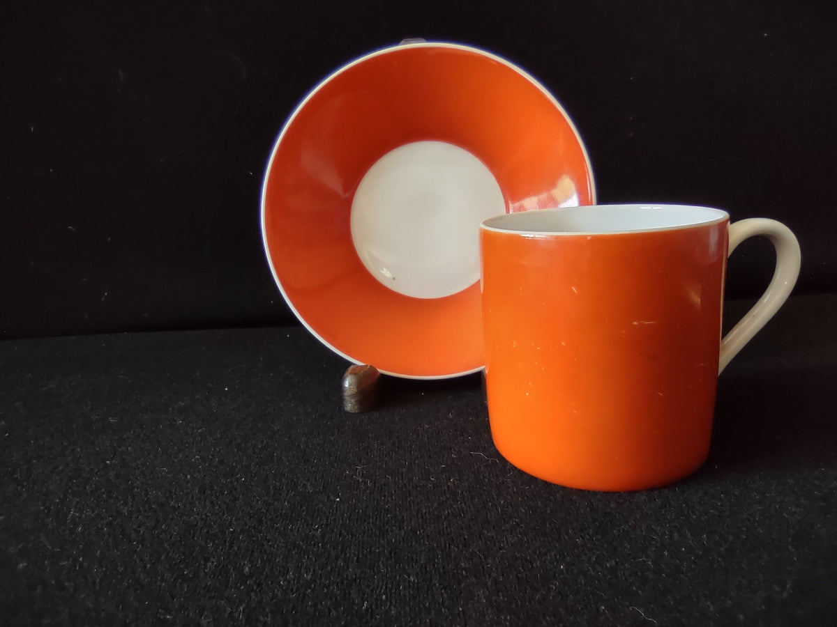 Vintage Royal Bayreuth orange demitasse cup and saucer set, bold orange glaze with white interior
