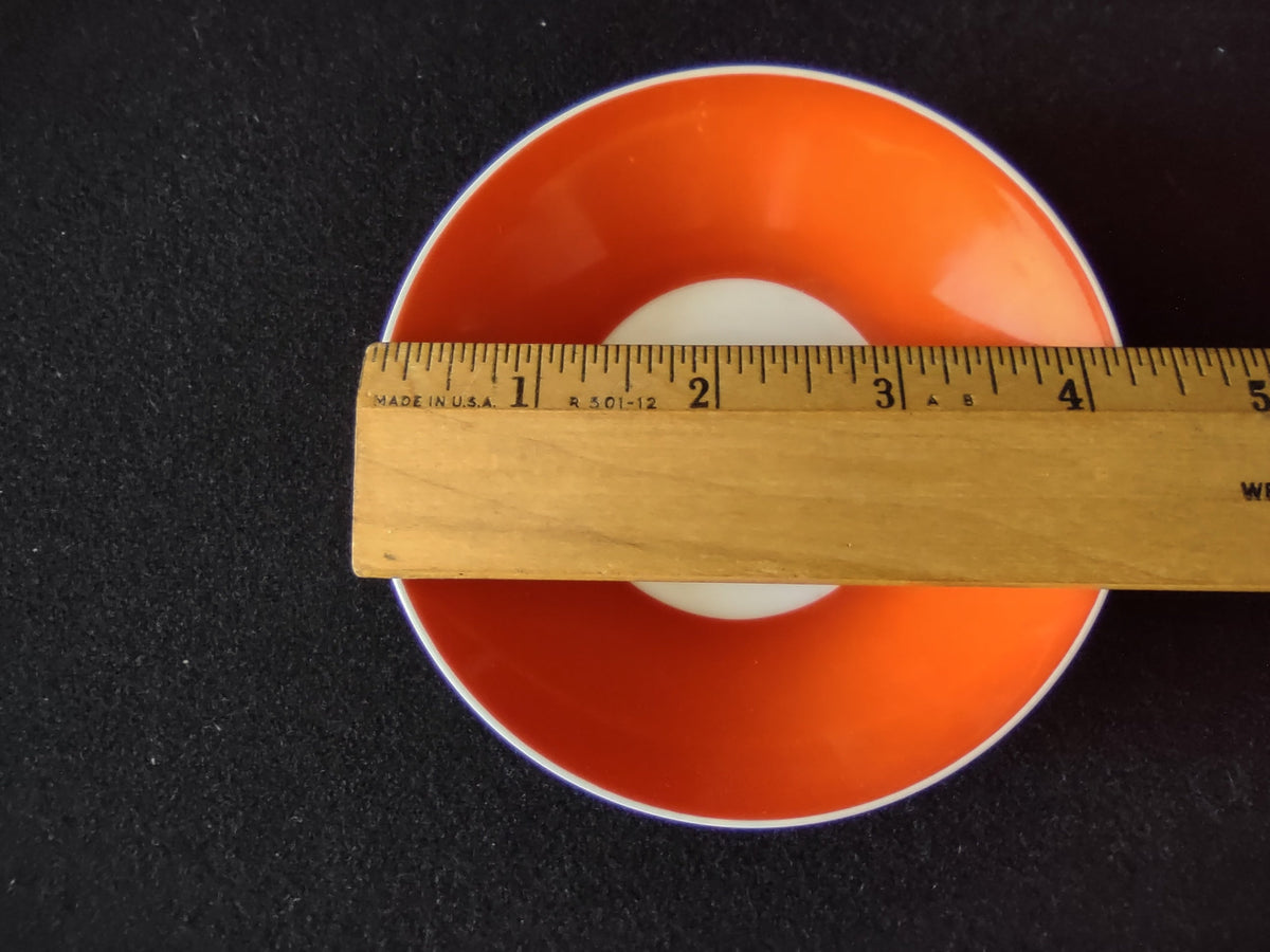 Royal Bayreuth orange cup and saucer side profile showing depth and white handle