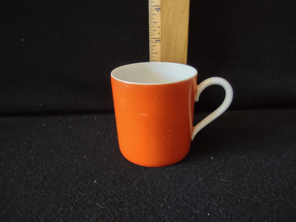Royal Bayreuth orange saucer side profile with ruler showing approximately 1 inch depth