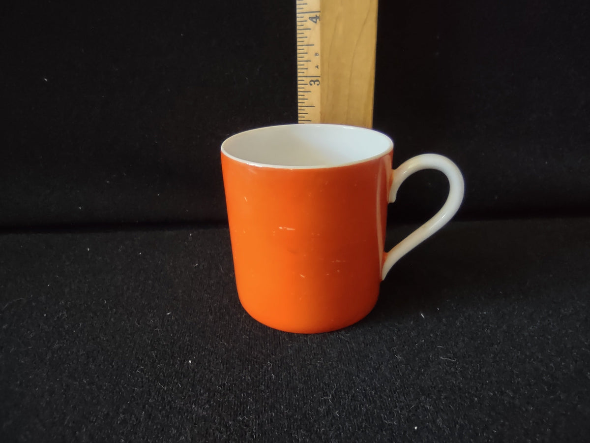 Royal Bayreuth orange saucer side profile with ruler showing approximately 1 inch depth